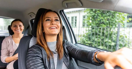 A rideshare driver picking up a passenger.