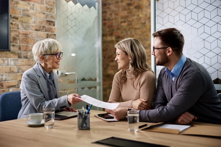 Insurance lady meeting with couple